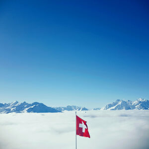 Swiss flag above the clouds